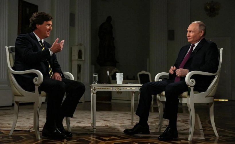 В ЦРУ рассекретили жест Путина во время интервью с Такером Карлсоном. Президент России снял с запястья часы